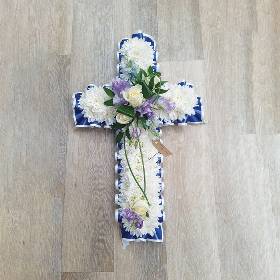 White chrysanthemum flower based cross funeral tribute with ribbon 