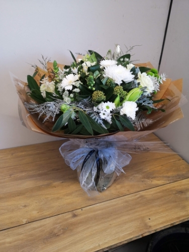 festive white chistmas flower handtied bouquet in a bubble of water