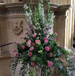 Large modern pink and lilac funeral flower pedestal