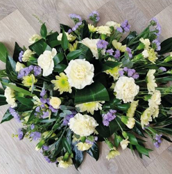 Lemon yellow and lilac single ended flower and foliage funeral coffin spray