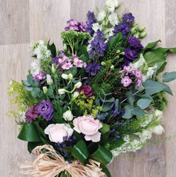 Country style pink and purple flower and foliage funeral tribute sheaf