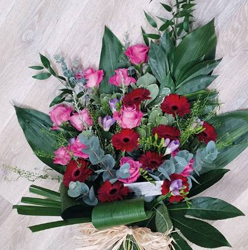 Red and pink flower and foliage funeral tribute 