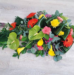 Contemporary flower and foliage single ended funeral coffin spray 