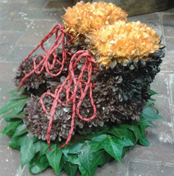 Walking boot flower and foliage funeral tribute with real laces