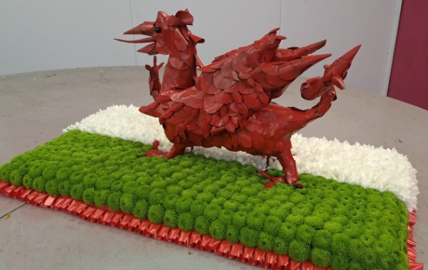 3d white, green and red welsh dragon flag flower funeral tribute