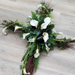 White cala lily flower and willow foliage cross funeral tribute 