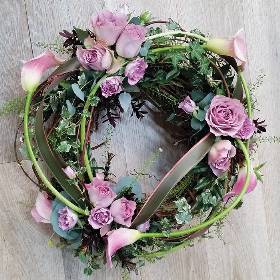 Willow and lilac rose flower and foliage funeral tribute wreath 