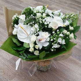 neutral white handtied flower bouquet gift wrapped in an aqua pack of water
